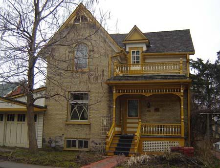 Front facade, featuring a dormer and decorative porch and balcony details.; Lindsay Benjamin, 2007.