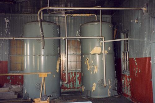 View of the interior of the Light Station: Fog Alarm, showing the remaining foghorn machinery, 1996.; Parks Canada Agency / Agence Parcs Canada, 1996.