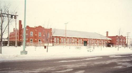 Rear view of the D.V. Currie VC Armoury, showing its economical, but high-quality design and construction, with careful attention to detailing and selection of materials, 1986.; Parks Canada Agency / Agence Parcs Canada, 1986.