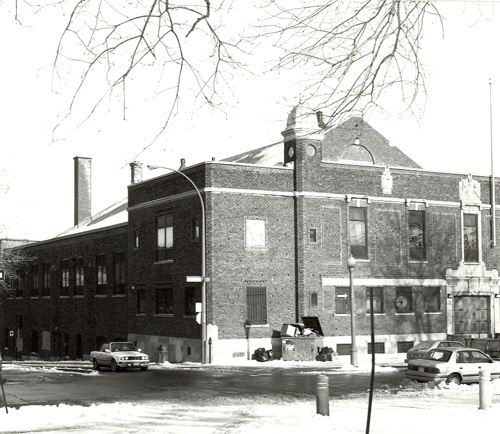 View of the exterior of the Armoury, showing the sections that house the administrative services and the utilitarian areas, 1993.; Department of National Defence / Ministère de la Défense nationale, 1993.