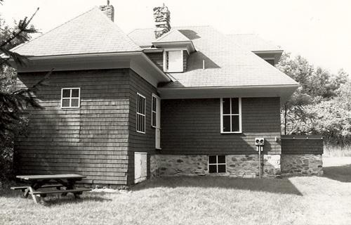 View of the exterior of Limberlost, showing rubble-stone foundation, 1992.; Parks Canada Agency / Agence Parcs Canada / Historica Resources Ltd., 1992.