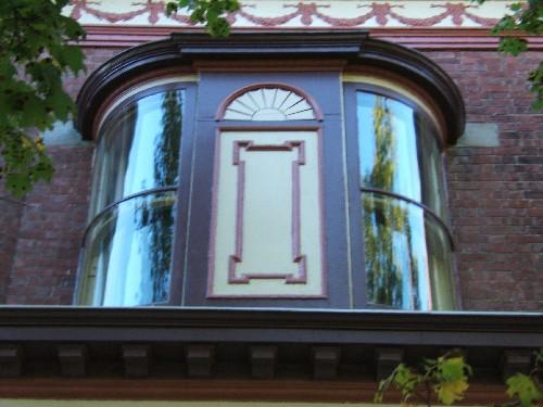 This photograph shows the oriel window, and illustrates a portion of the frieze band below the cornice, 2005; City of Saint John