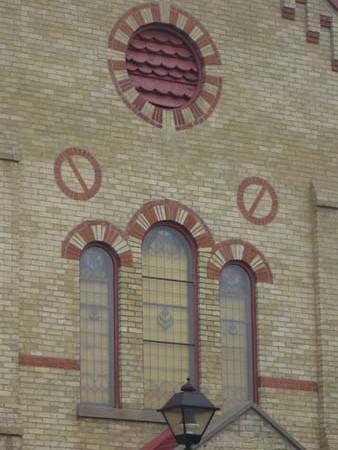 Of note is the orange-brick detailing of the window arches and exterior walls.; Kayla Jonas, 2007.