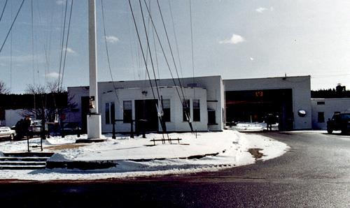 Rear view of Building 3, showing its wood-frame, standardized construction system and shingle cladding; Department of National Defence / Ministère de la Défense nationale, 1993.