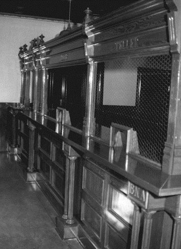 Detail view of the Bank of British North America, showing the interior partitioning and finishes, 1988.; Parks Canada Agency / Agence Parcs Canada, J. Mattie, 1988.