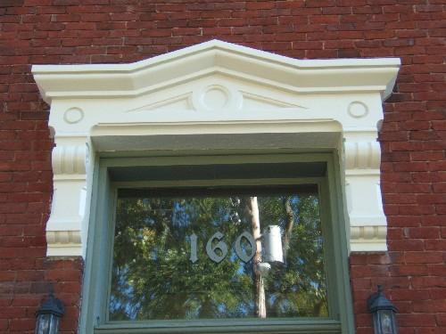 This photograph shows the ornate entablature over the entrance, 2005; City of Saint John
