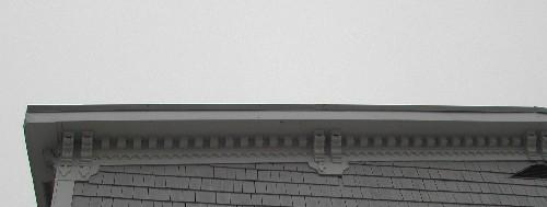 This image provides a view of the bracketed wood cornice ornamented by dentils and other decorative wood work, 2005; City of Saint John
