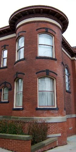This image provides a view of the circular tower projecting off of the northwest corner of the building, 2005; City of Saint John