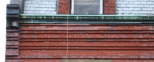 This image provides a view of the cornice supported by corbelled end brackets, 2005; City of Saint John