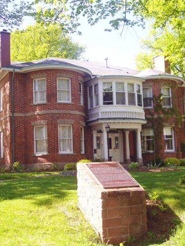 General view of the Fairholm villa emphasizing the symmetry of the main façade; the central door surrounded by sidelights and a graceful elliptical fanlight; and the even disposition of openings, 2006.; Parks Canada Agency / Agence Parcs Canada, 2006