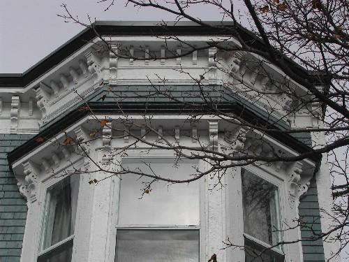 This photograph shows the roof-line cornice and the cornice above the bay window  , 2005; City of Saint John