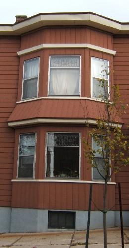 This image provides a view of the two-storey semi-octagonal bay window on the west side of the front façade, 2005; City of Saint John