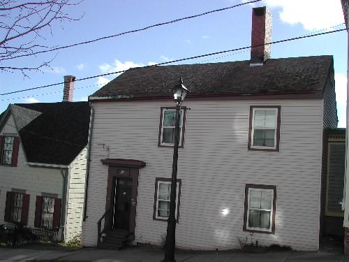 This photograph shows the front façade of the building, 2005; City of Saint John