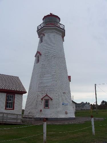 View of the exterior of the tower, showing the heavy timber frame structure clad in painted wood shingles, 2009.; Parks Canada Agency / Agence Parcs Canada, Jamie Mitchell, 2009.