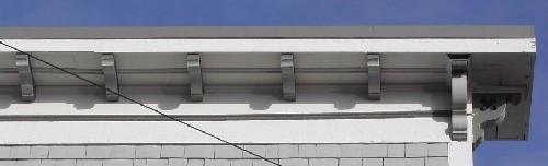 This image provides a view of the large cornice ornamented by modillions and supported by decorative brackets, 2005; City of Saint John