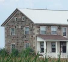 Of note are the cut limestone corner quoins.; Kendra Green, 2007.