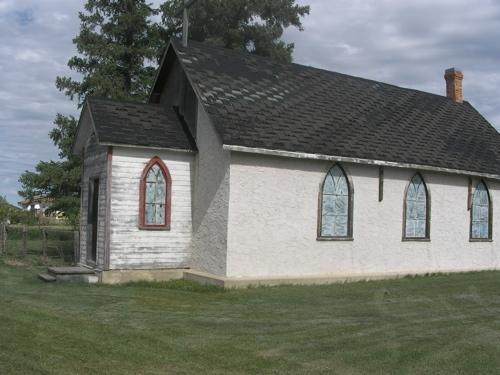 Anglican Church, side elevation showing newer stucco cladding and original siding on vestibule; Fedyk, 2008