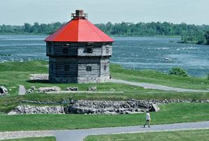 View of Coteau-du-lac, showing its location on the shores of the St. Lawrence River, 1982.; Parks Canada Agency / Agence Parcs Canada, F. Cattroll, 1982.