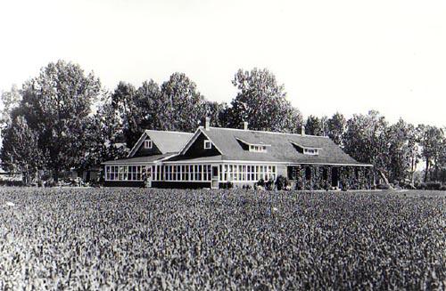The photo dates from circa 1927 after the completion of the addition to the ranch house. The addition with its glazed porch is at the rear left hand side.; Glenbow Museum NA-460-22