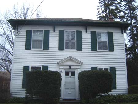 West facing façade featuring pediment with fluted half columns and tympanum, 2007.; Lindsay Benjamin, 2007.