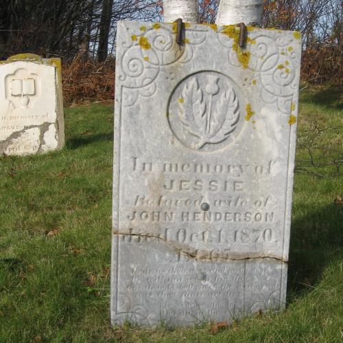 Showing stone detail with thistle motif; PEI Genealogical Society, 2007