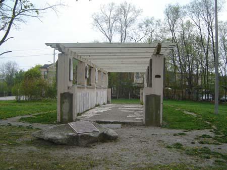 Of note are the waist high walls, pillars and open beam roof.; Kayla Jonas, 2007.
