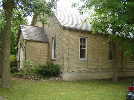 Of note is the slate roof and white brick construction.; Kayla Jonas, 2007.