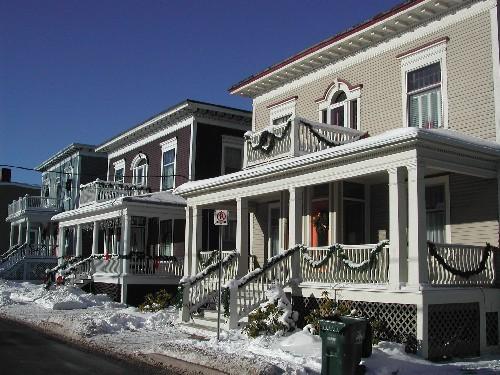 This photograph shows the contextual view of the three near-identical Craftsman Style homes in succession on this blockface, 2005; City of Saint John