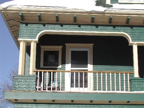 This photograph shows the upper storey of the verandah and the exposed rafter tails under the eaves, 2005; City of Saint John
