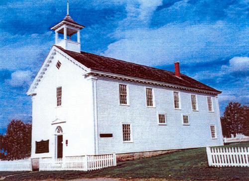 View of the main entrance of the Argyle Township Court House and Jail, showing its dentilled and returned eaves and its corner pilasters, 1999.; Parks Canada Agency / Agence Parcs Canada, P. Muise, 1999.