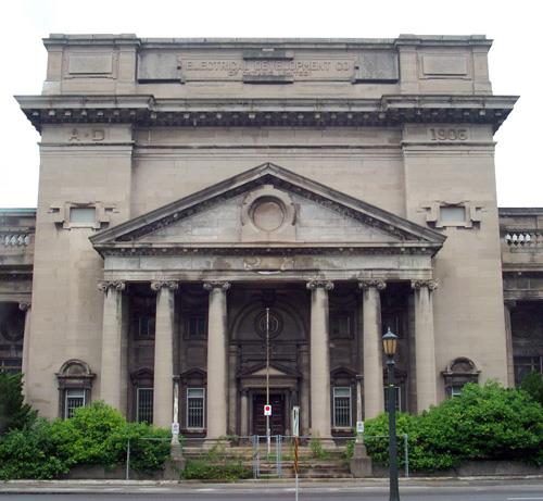 Façade of the Electrical Development Company Generating Station and Powerhouse, showing the projecting central block with a heavy Ionic portico, 2005.; Parks Canada Agency / Agence Parcs Canada, 2005.
