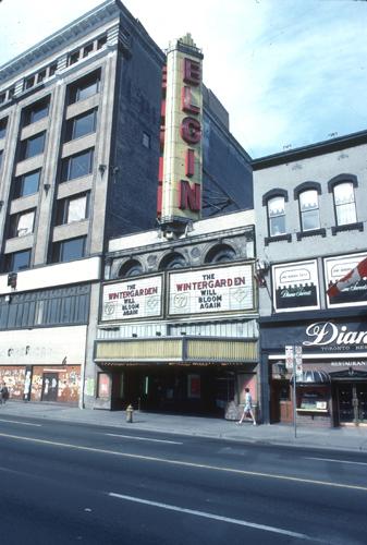 Exterior view of the Elgin and Winter Garden Theatres, showing its classically inspired, masonry and terracotta façade with an ornate marquee.; Parks Canada Agency / Agence Parcs Canada.