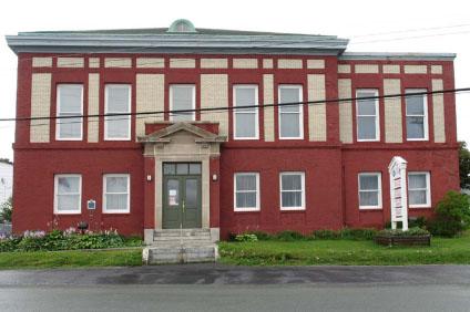 General view of the Cable Building, showing the symmetrical disposition of openings, 2006.; Parks Canada Agency / Agence Parcs Canada, N. Miquelon, 2006.