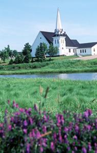 View of the exterior of Tryon United Church, showing its picturesque setting on the river bank, 1995.; Parks Canada Agency / Agence Parcs Canada, J. Butterill, 1995.