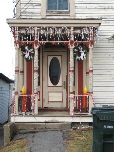 This photograph shows the wood panelled door, sidelights and the large portico over the entrance, 2006; City of Saint John