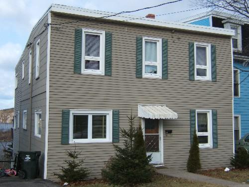 This photograph shows the contextual view of the building, 2006; City of Saint John