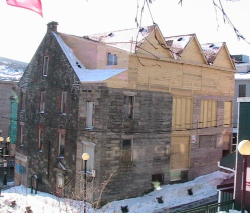 Exterior photo of the rear facade of Yellow Belly Corner, shown during restoration work, photo circa 2005.; HFNL 2006
