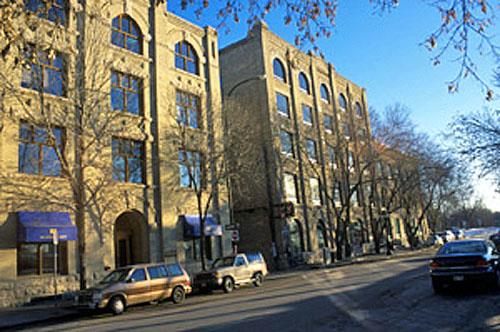 General view of buildings in the Exchange District National Historic Site of Canada emphasizing the  intensive occupation of building lots with buildings constructed up to the sidewalks and corners, 2003.; Parks Canada Agency / Agence Parcs Canada, K. Dahlin, 2003.