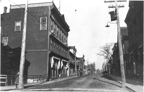 Elkin Block on left. Taken on Water Street circa, looking northeast; NB Provincial Archives, image P380-65