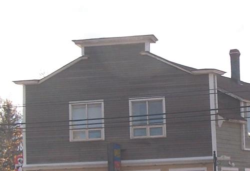 This image shows the traditional boomtown parapet, 2007; Town of Shippagan