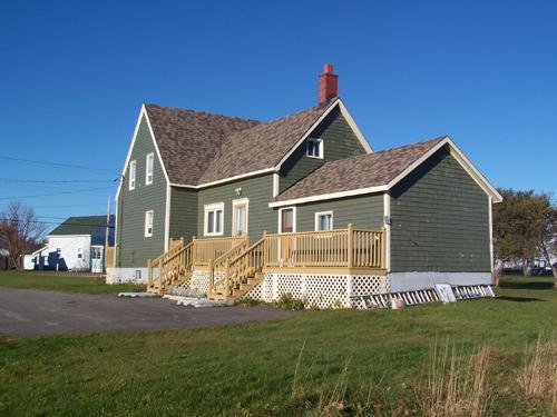 This image shows the rear view of the building; Town of Shippagan