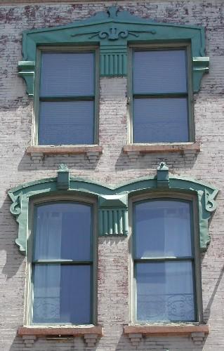 This photograph shows a pair of segmented arch windows  and a pair of rectangular windows, 2005; City of Saint John