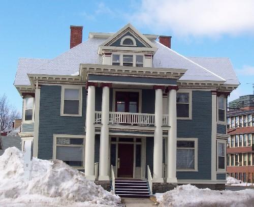 View of Kilburn House, fronting on Smythe Street, showing two-storey columns and second floor balcony; City of Fredericton