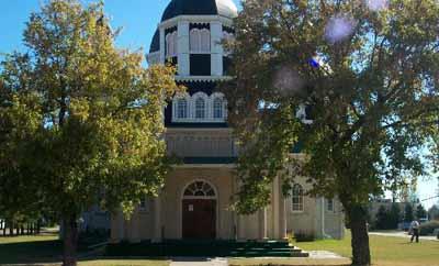 View of the Ukrainian Catholic Church of the Resurrection, showing the classically inspired exterior detailing including a symmetrically arranged façade with columned entry porch, 2001.; Parks Canada Agency / Agence Parcs Canada, 2001.