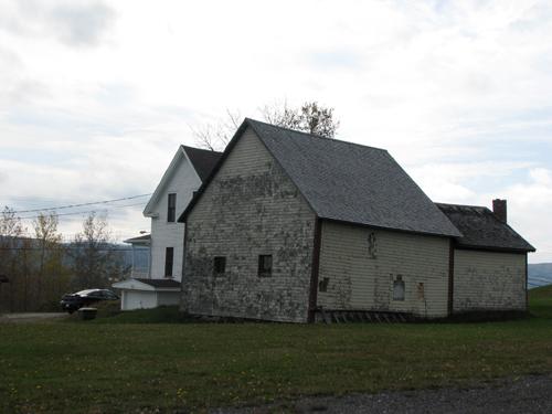 Photo of the side and the rear of the buildings, taken on an angle; Madawaska Planning Commission