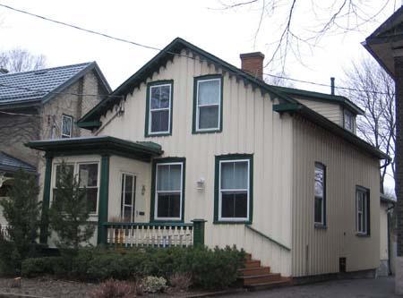 Featured is the front entrance portico with simple entablature and Doric columns, 2007.; Lindsay Benjamin, 2007.