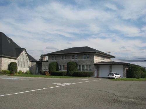 Angled view of the rectory taken from Principale Street; Madawaska Planning Commission