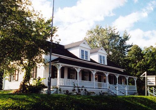 Illustrates the front verandah and the two dormers.; PNB 2003
