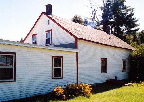 Corner view of the rear of the building.  It illustrates 2 openings on the original section and 2 openings on the addition.; PNB 2003