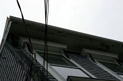 This image shows a view of cornice overhang and entablature brackets; City of Saint John